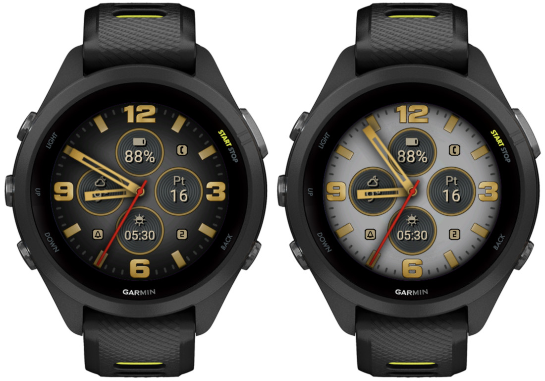 Two Garmin smartwatches displaying different watch faces side by side, one with a black background and yellow accents, and the other with a white background and gold accents, showing time, battery percentage, and other metrics.